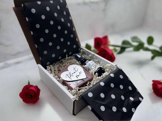 Gift set with polka dot box and items on a table